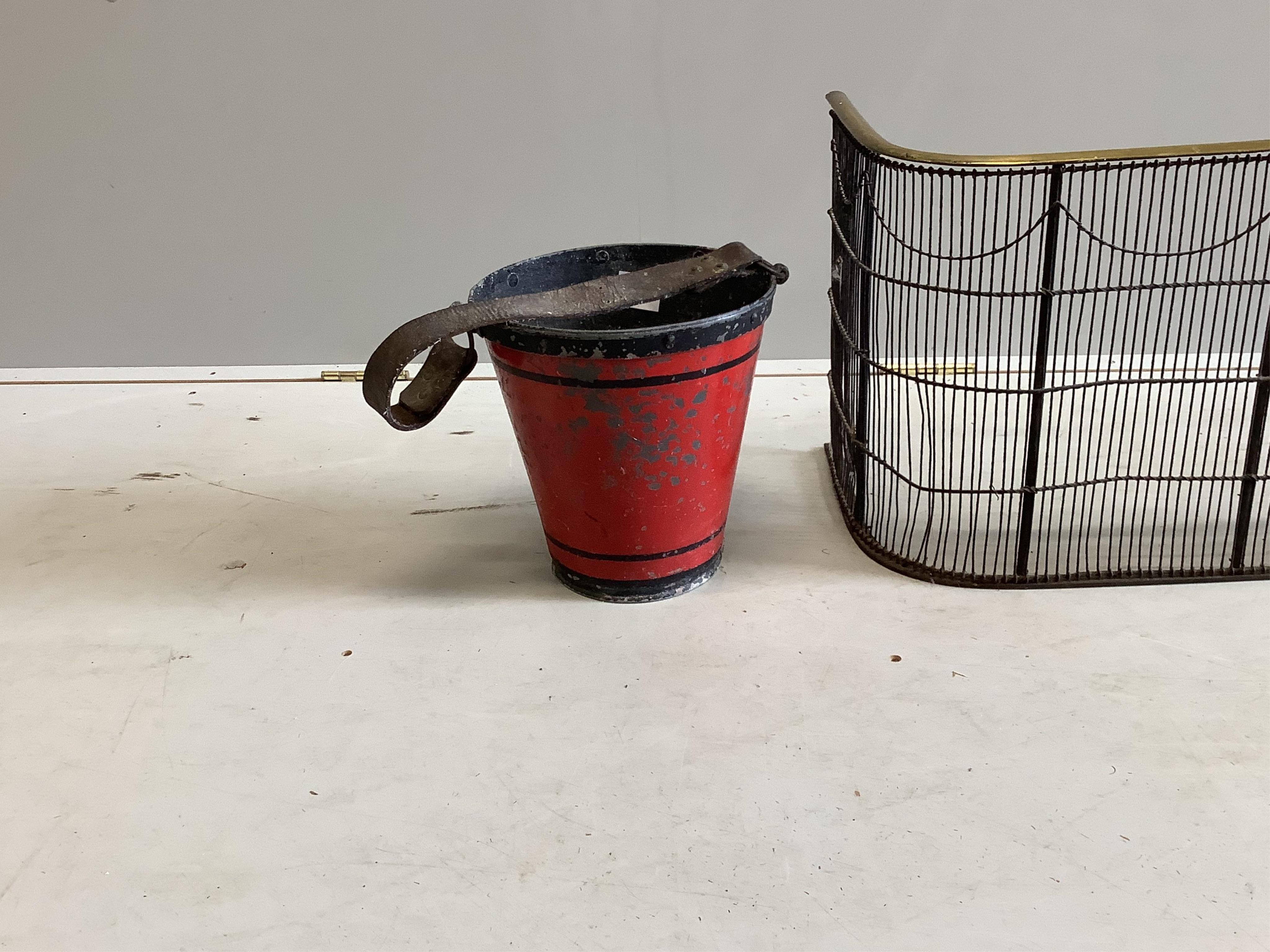 A painted metal bucket, diameter 24cm, height 25cm, together with a Victorian spark guard. Condition - poor